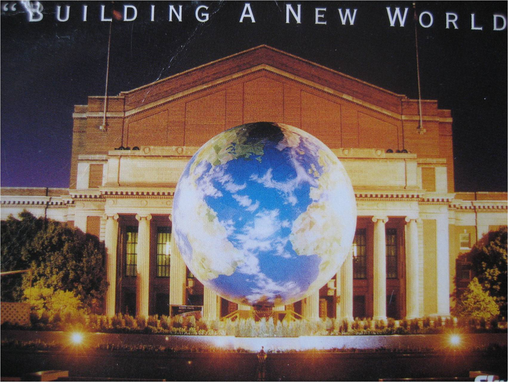 The Great Globe illuminated at night in front of a classical building - Building A New World